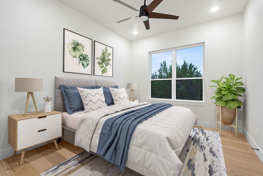 Bright interior space featuring a large window, recessed lighting, a ceiling fan with integrated light, and wood-finish flooring