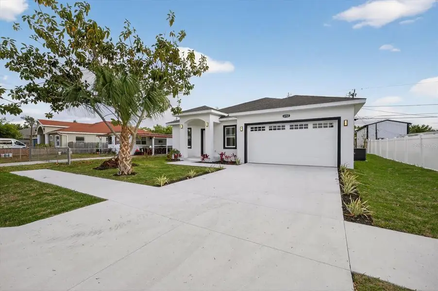 Front exterior of a new home in , Pinellas Park, FL, highlighting curb appeal (Image 18).