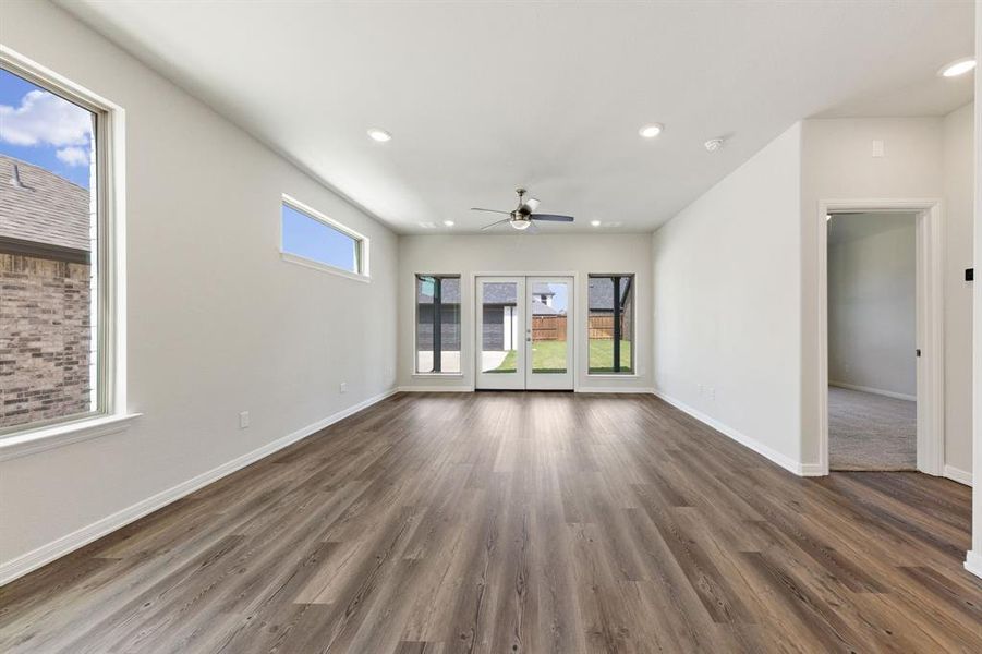 With a wall of windows looking out to your back yard, this family room offers a warm and inviting place to gather.