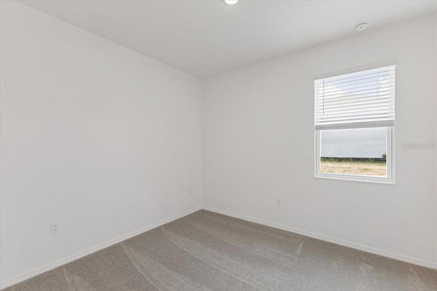 Spacious, unfurnished interior of a new home in Highfield at Twisted Oaks, Wildwood (Image 13).