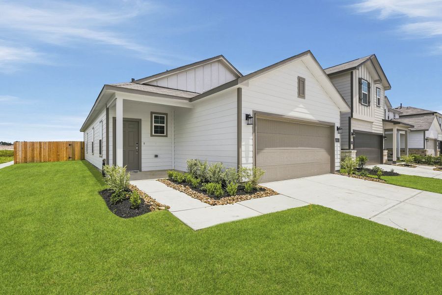 Front exterior of a new home in Northpark South, Porter, TX, highlighting curb appeal (Image 1). Front exterior of a new home in Northpark South, Porter, TX, highlighting curb appeal (Image 1).