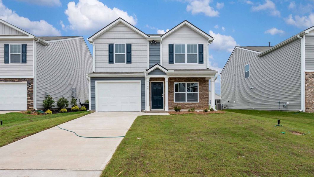 Front exterior of a new home in Cloverdale Hills, Piedmont, SC, highlighting curb appeal (Image 1).