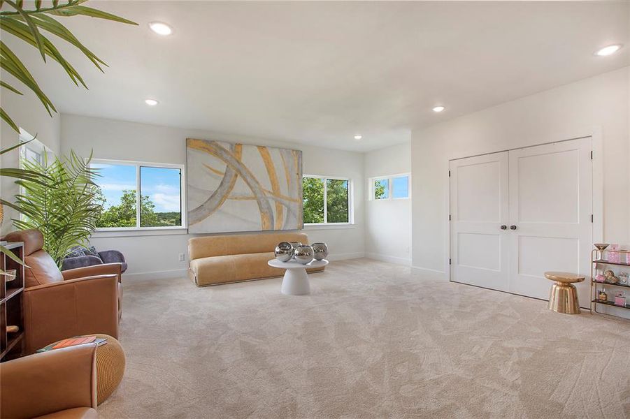Sitting room featuring carpet flooring and recessed lighting Sitting room featuring carpet flooring and recessed lighting