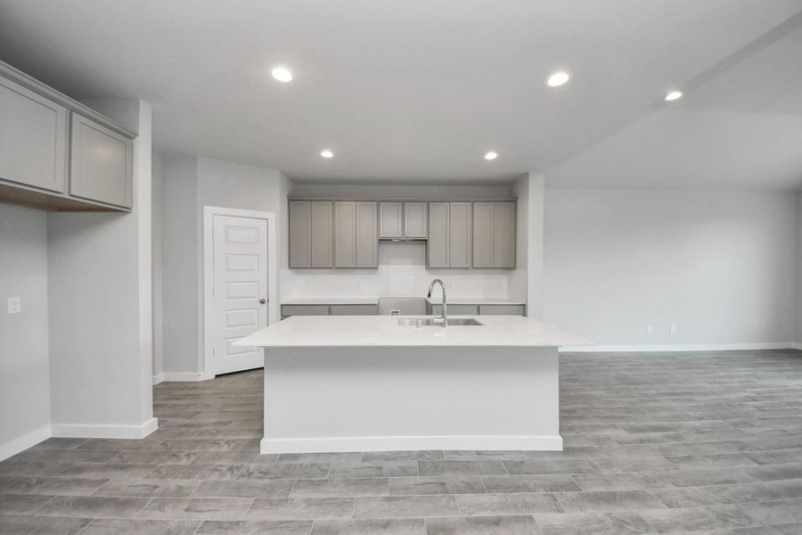 This generously spacious kitchen is a dream realized! Sample photo of completed home with similar floor plan. Actual colors and selections may vary.