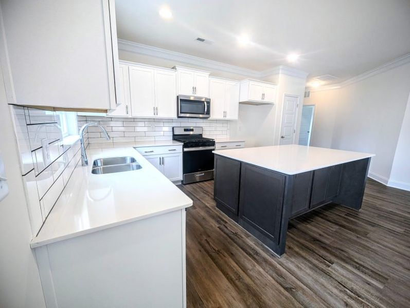 Furnished interior view inside a new home in Royal Pines, Trinity (Image 4).