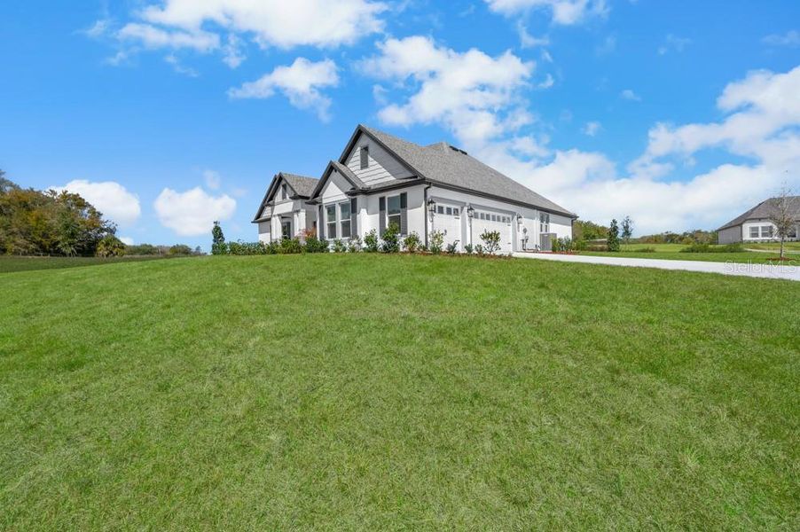 Front exterior of a new home in , Fruitland Park, FL, highlighting curb appeal (Image 20). Front exterior of a new home in , Fruitland Park, FL, highlighting curb appeal (Image 20).
