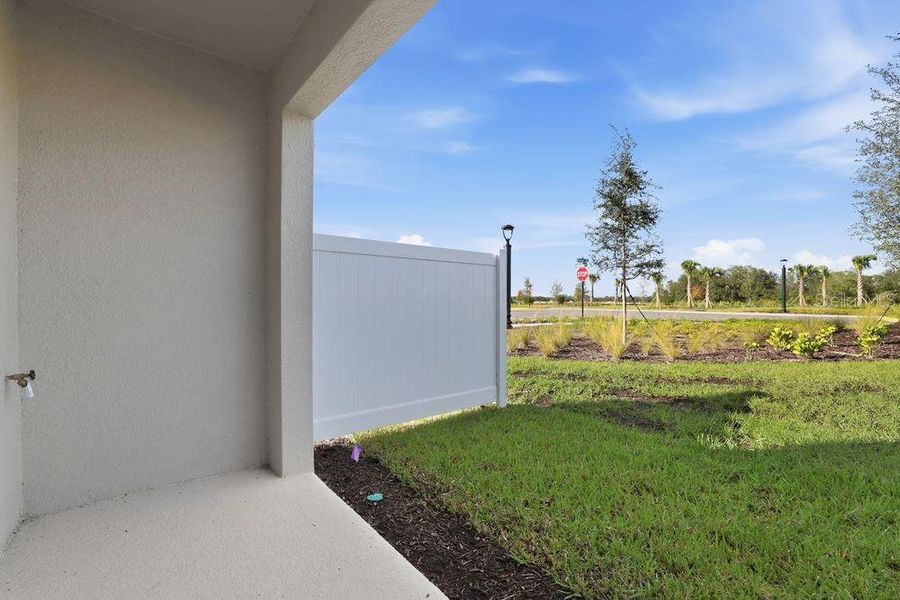 Exterior details and patio area of a home in The Towns at Firethorn, Parrish (Image 27).