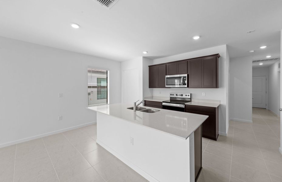 Furnished interior view inside a new home in Caloosa Cove, Labelle (Image 5).