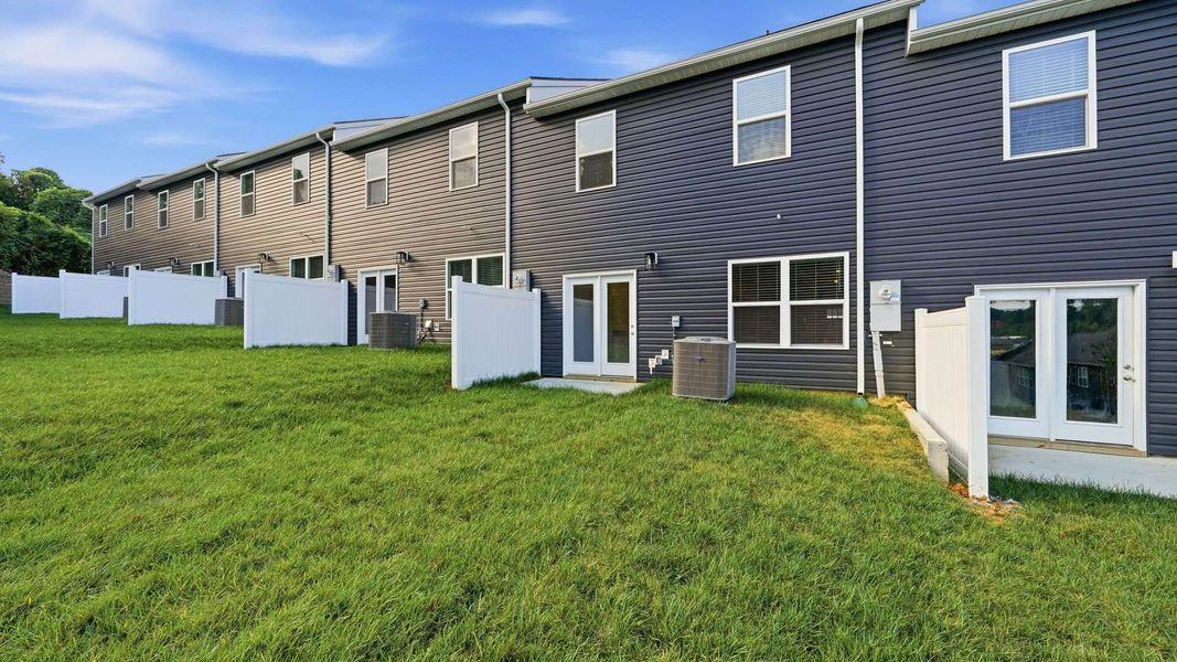 Exterior details and patio area of a home in The Arbor Townhomes, Kingsport (Image 15).