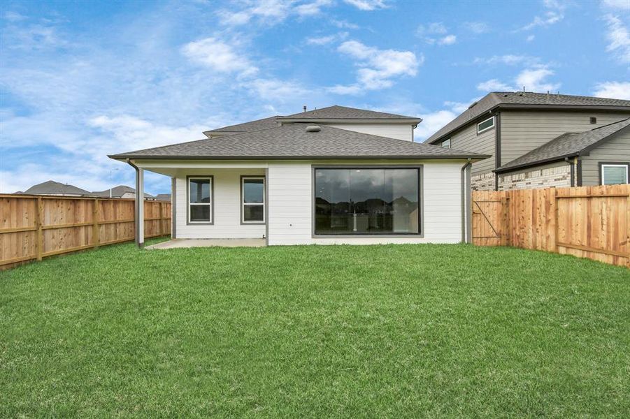 Experience outdoor living at its finest on this expansive covered patio, thoughtfully designed for BBQs and delightful outdoor dining