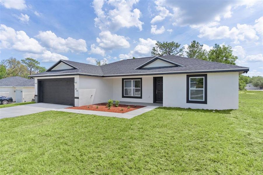 Front exterior of a new home in , Ocklawaha, FL, highlighting curb appeal (Image 18).