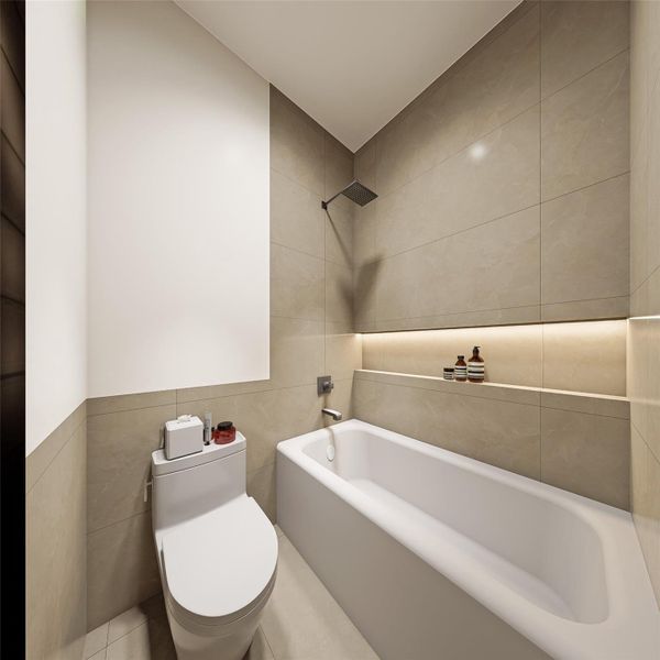 Downstairs bathroom with tile all the way to the ceiling.