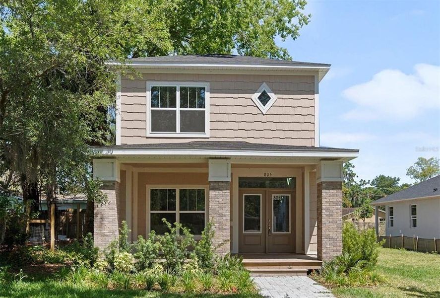 Front exterior of a new home in , Sanford, FL, highlighting curb appeal (Image 1). Front exterior of a new home in , Sanford, FL, highlighting curb appeal (Image 1).