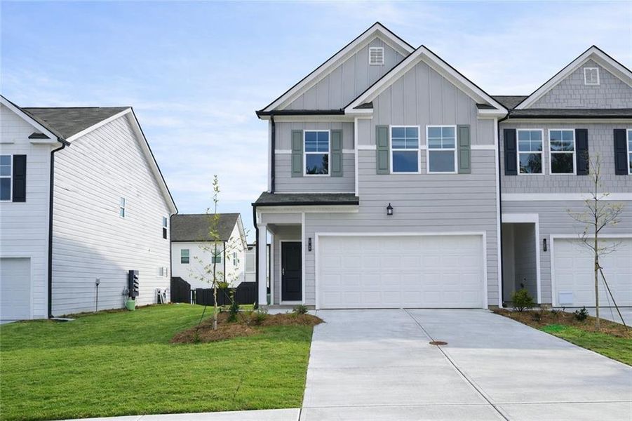Front exterior of a new home in Rivershire Place, Villa Rica, GA, highlighting curb appeal (Image 1). Front exterior of a new home in Rivershire Place, Villa Rica, GA, highlighting curb appeal (Image 1).