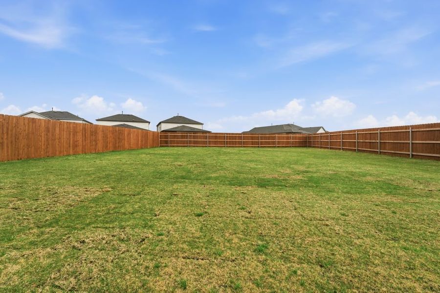 Exterior details and patio area of a home in Emory Crossing, Hutto (Image 13).