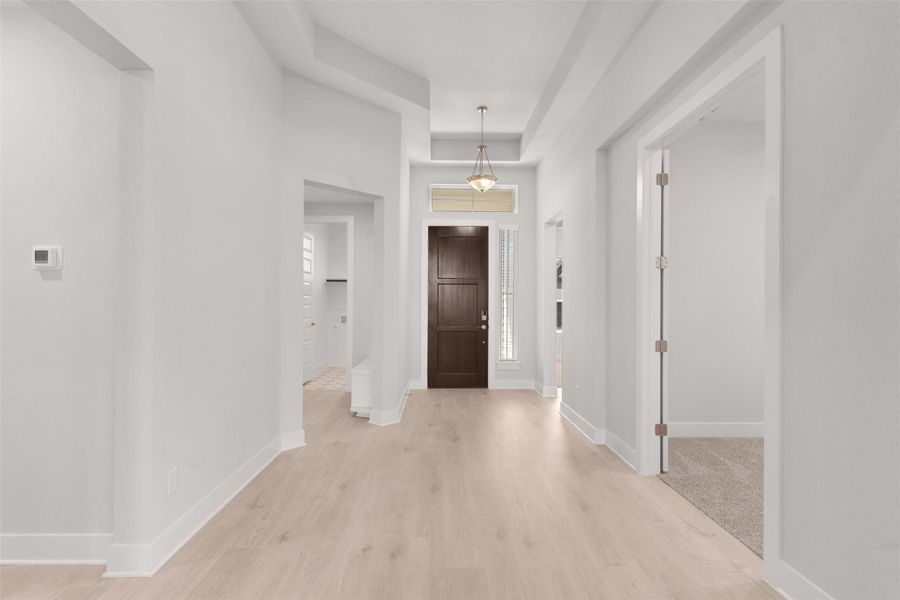Foyer entrance featuring baseboards and light wood-style flooring