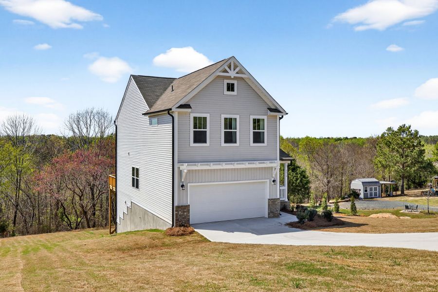 Front exterior of a new home in Grandview, Albemarle, NC, highlighting curb appeal (Image 1). Front exterior of a new home in Grandview, Albemarle, NC, highlighting curb appeal (Image 1).