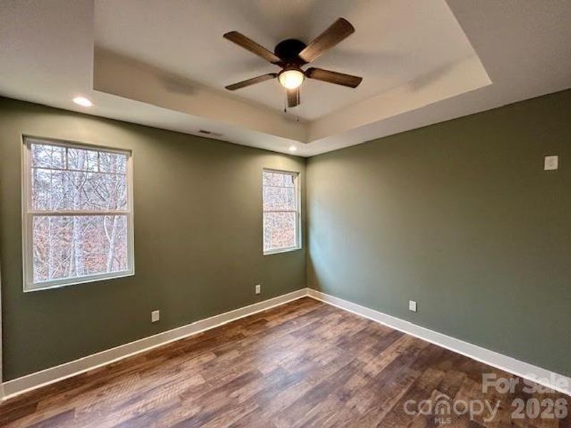 Primary Bedroom with coffer ceilings and 9' ceings