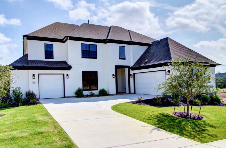 Representative exterior photo of a completed home built from the Signature Series - Partridge by DRB Homes in Oaks at San Gabriel, Georgetown, TX (Image 24). Representative exterior photo of a completed home built from the Signature Series - Partridge by DRB Homes in Oaks at San Gabriel, Georgetown, TX (Image 24).