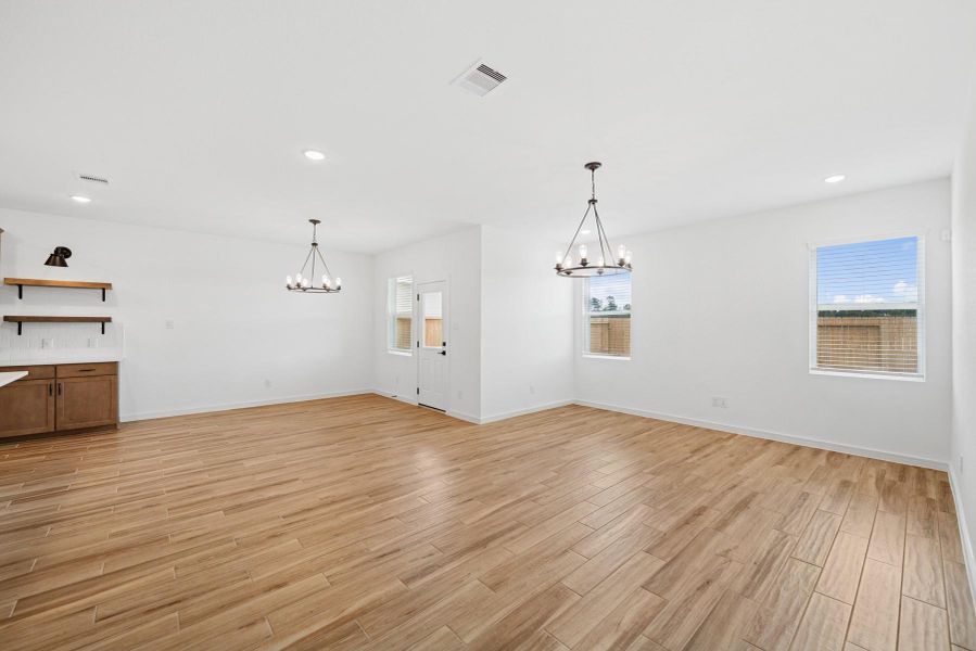 Bright and open great room and dining area Bright and open great room and dining area