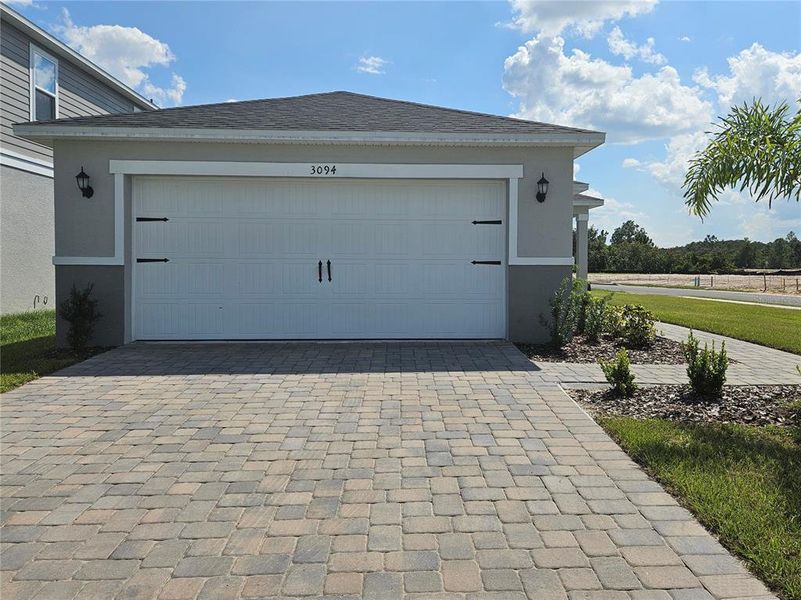 Front exterior of a new home in , Clermont, FL, highlighting curb appeal (Image 16).
