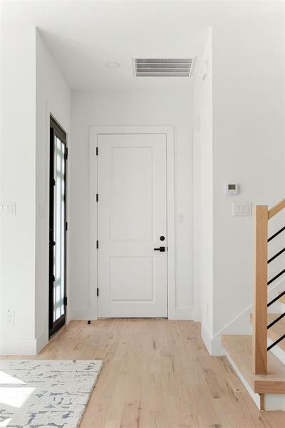 Entrance foyer featuring light wood-type flooring