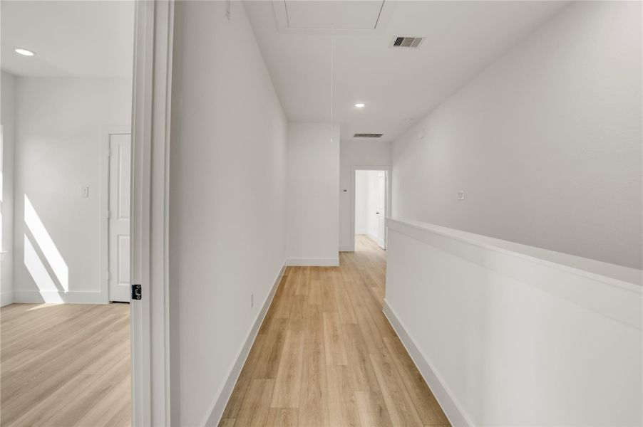 The home has a spacious landing on the second floor that can easily fit a work desk.