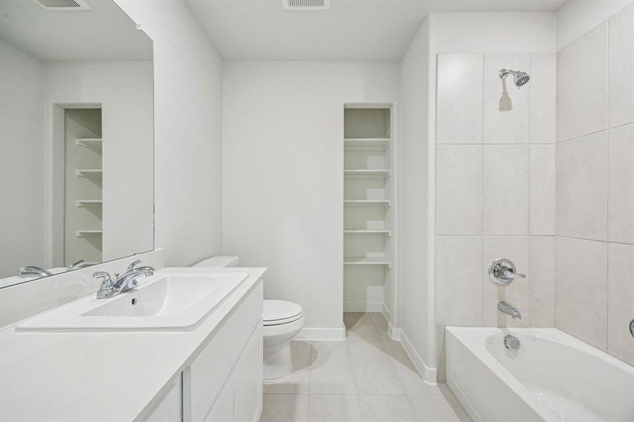 Bathroom in the Stanley II home plan by Trophy Signature Homes – REPRESENTATIVE PHOTO