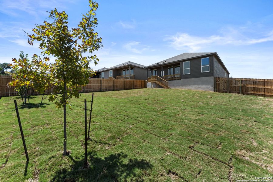 Front exterior of a new home in Waterwheel: Coastline Collection, San Antonio, TX, highlighting curb appeal (Image 1). Front exterior of a new home in Waterwheel: Coastline Collection, San Antonio, TX, highlighting curb appeal (Image 1).