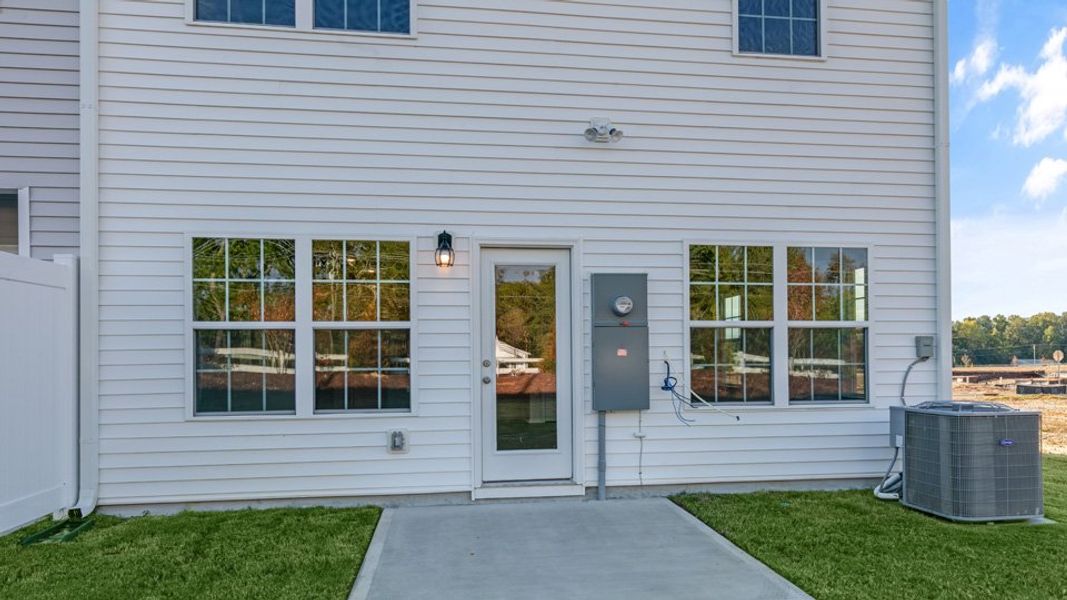 Front exterior of a new home in Brightwood Farm, Whitsett, NC, highlighting curb appeal (Image 16).