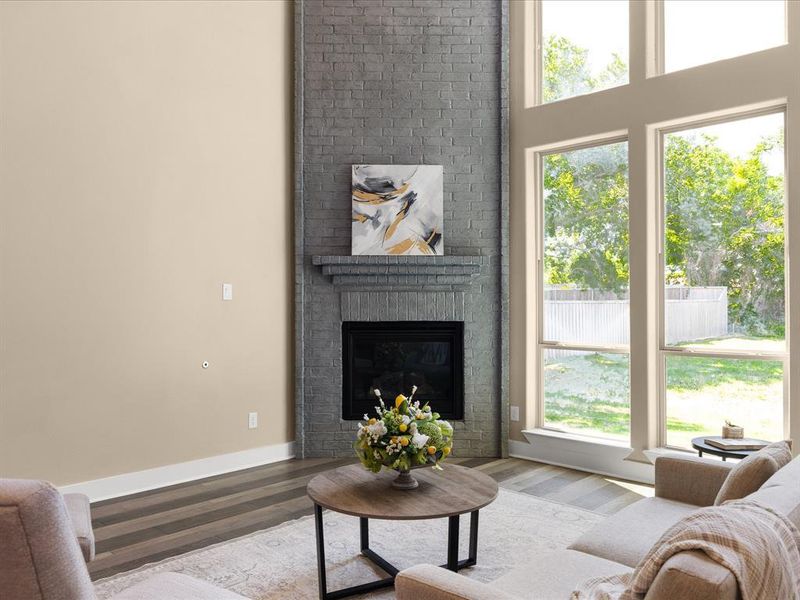 Living room with a fireplace and wood finished floors