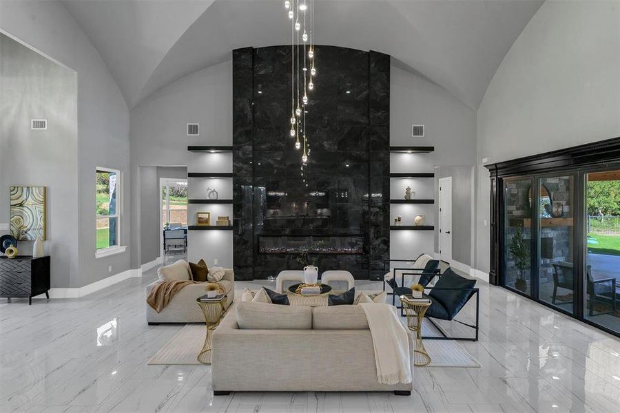 Living room featuring high vaulted ceiling