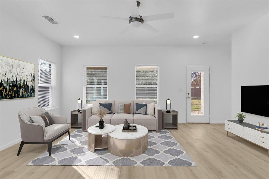 Living room featuring light wood-type flooring, healthy amount of natural light, recessed lighting, and ceiling fan