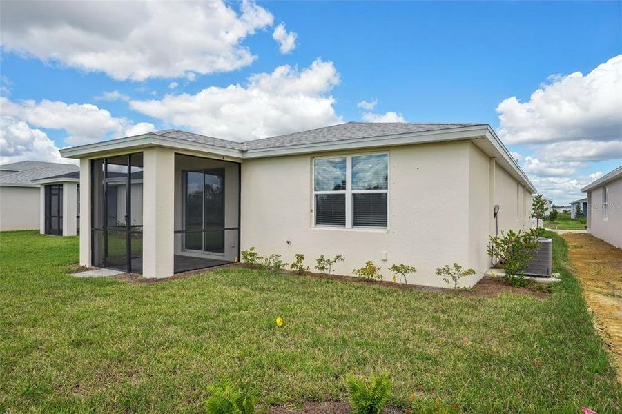 Exterior details and patio area of a home in Crescent Lakes - Premier Series, Punta Gorda (Image 18).