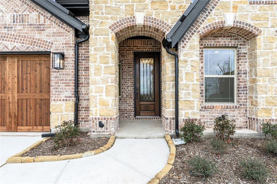 Exterior details and patio area of a home in Stone River Glen 60s, Royse City (Image 3).