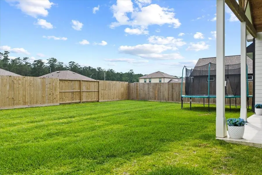 Exterior details and patio area of a home in , Anahuac (Image 3).