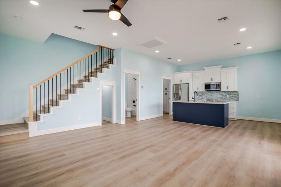 Downstairs living area, utility room, kitchn and den