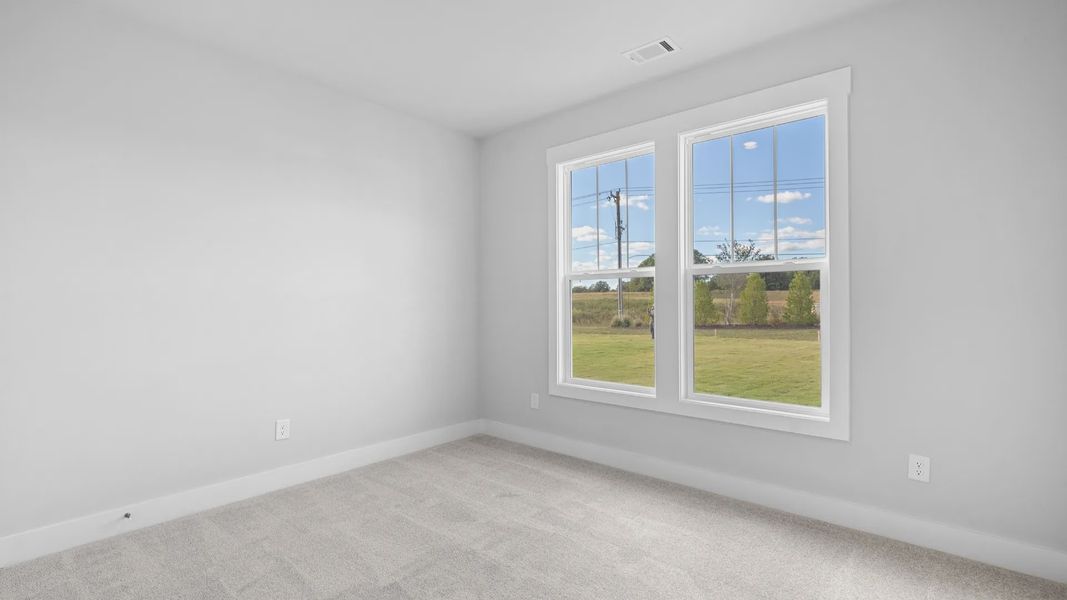 2 story single family home, all white, bedroom