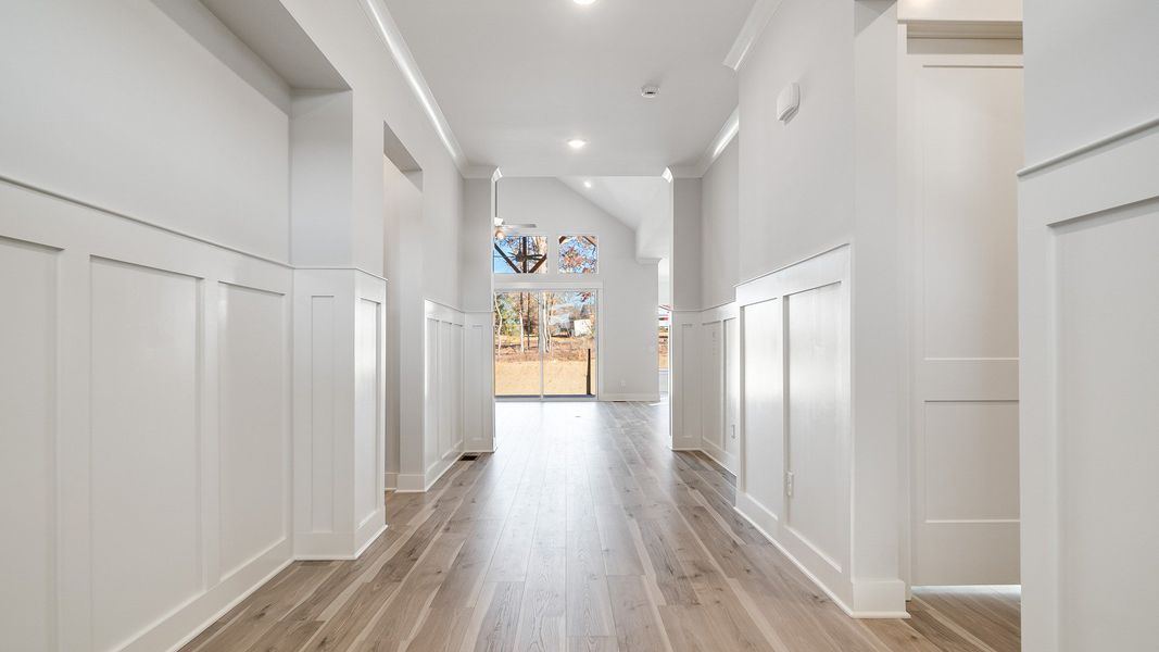 Gorgeous white painted and trimmed hallway with natural light