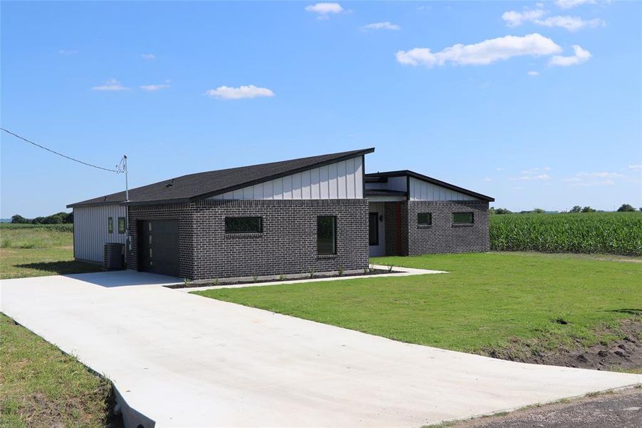 Front exterior of a new home in , Avalon, TX, highlighting curb appeal (Image 2). Front exterior of a new home in , Avalon, TX, highlighting curb appeal (Image 2).