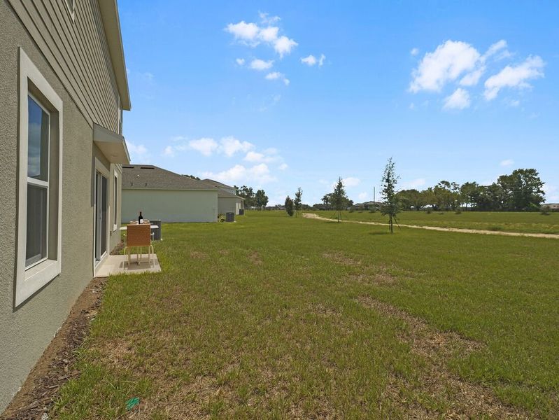 Representative exterior photo of a completed home built from the Azalea by Taylor Morrison in Scenic Terrace, Lake Hamilton, FL (Image 28).