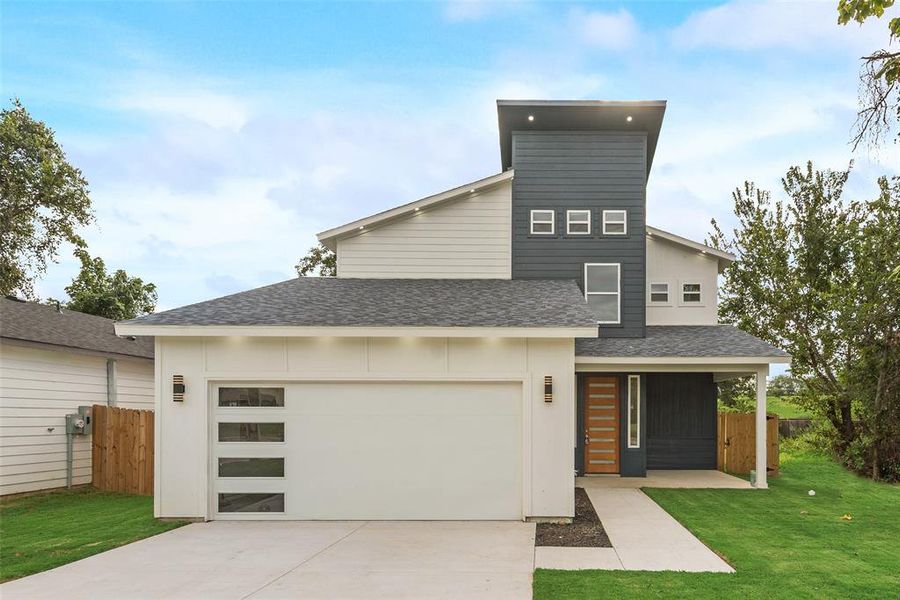 Contemporary house featuring a shingled roof, concrete driveway, an attached garage, and a porch Contemporary house featuring a shingled roof, concrete driveway, an attached garage, and a porch
