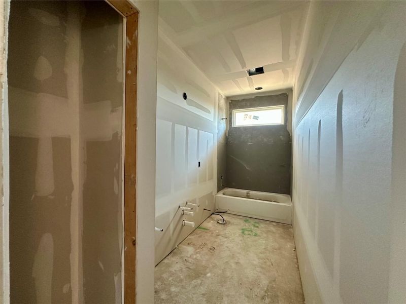 Bathroom featuring a washtub