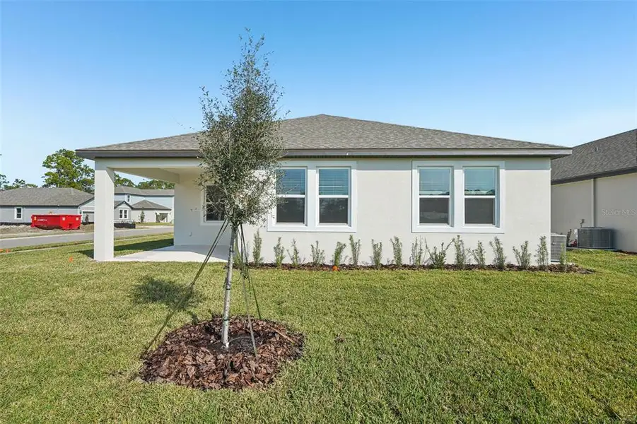 Exterior details and patio area of a home in Legends Preserve - Signature Series, Daytona Beach (Image 4). Exterior details and patio area of a home in Legends Preserve - Signature Series, Daytona Beach (Image 4).