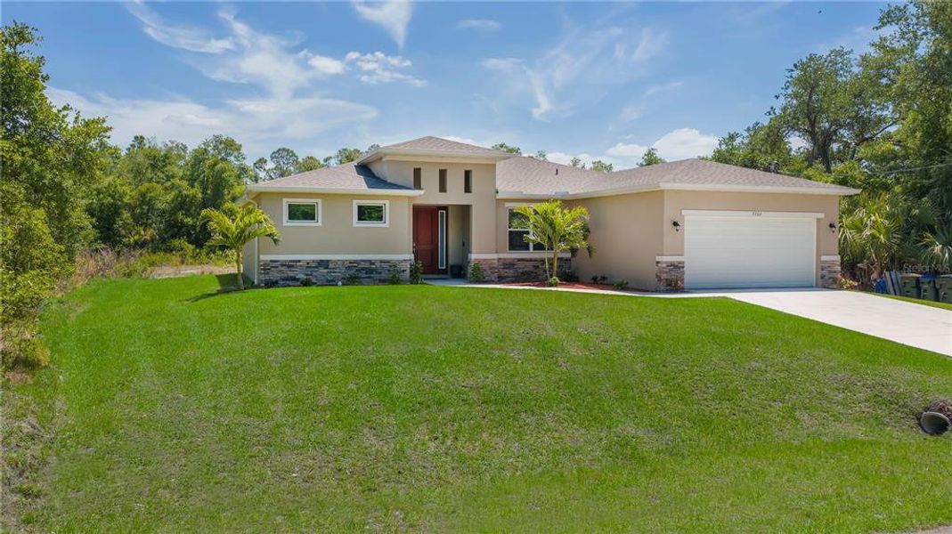 Front exterior of a new home in , North Port, FL, highlighting curb appeal (Image 23).