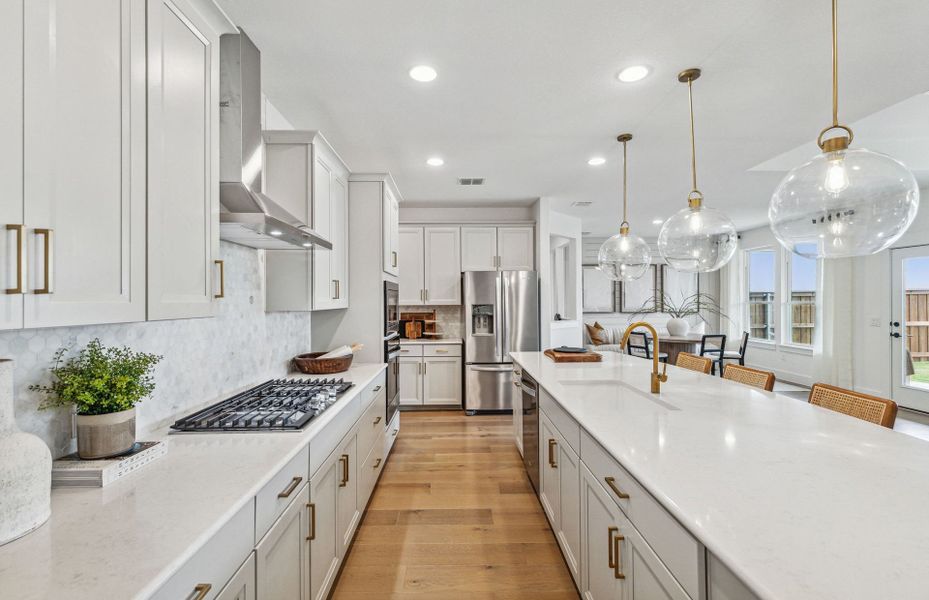 Recessed lighting in kitchen and views of cafe are