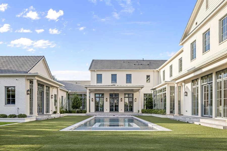 Back of house featuring a patio and a lawn Back of house featuring a patio and a lawn