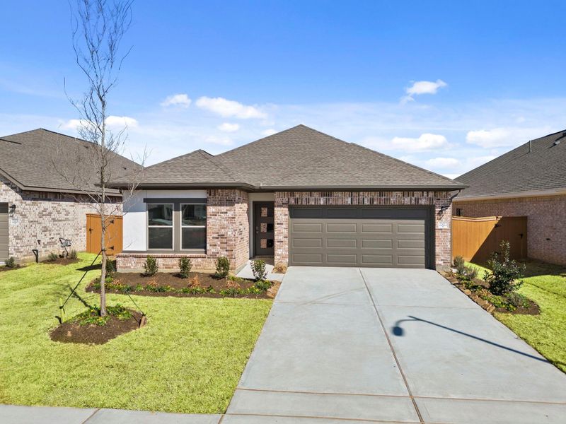 Front exterior of a new home in Cypress Green, Hockley, TX, highlighting curb appeal (Image 21).