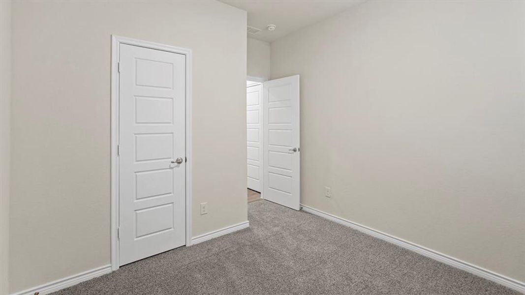 Unfurnished bedroom featuring carpet floors and baseboards Unfurnished bedroom featuring carpet floors and baseboards