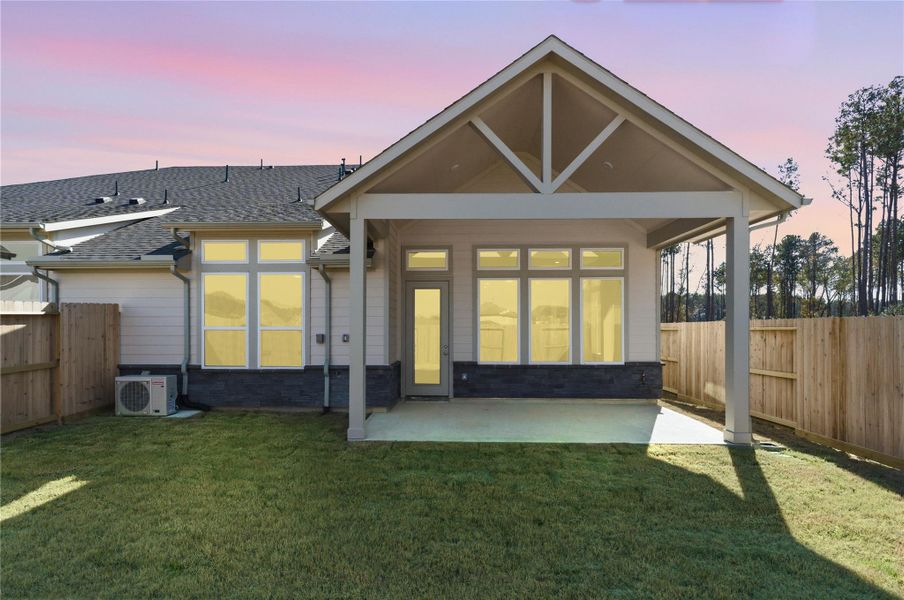 The covered patio offers a functional extension of your indoor living space, providing shade from the sun and shelter from the elements for comfortable outdoor dining or relaxation.